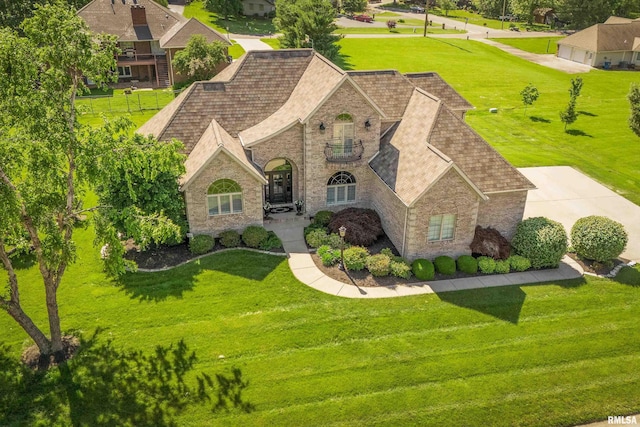 1302 Collins Ln, Marion, IL 62959 - view of front facade featuring brick siding, a shingled roof, and a front yard