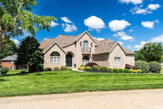 1302 Collins Ln, Marion, IL 62959 - french country home with brick siding and a front lawn