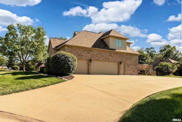 1302 Collins Ln, Marion, IL 62959 - view of property exterior with driveway, an attached garage, a lawn, and brick siding