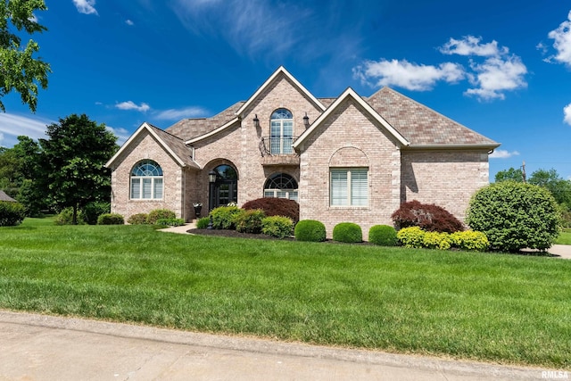 1302 Collins Ln, Marion, IL 62959 - french country inspired facade featuring brick siding and a front yard