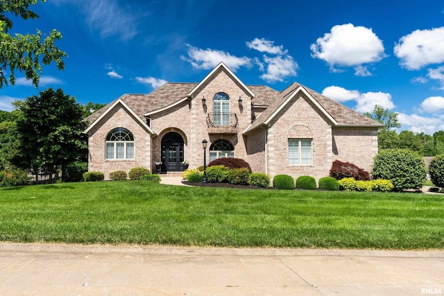 1302 Collins Ln, Marion, IL 62959 - french country inspired facade with brick siding and a front yard