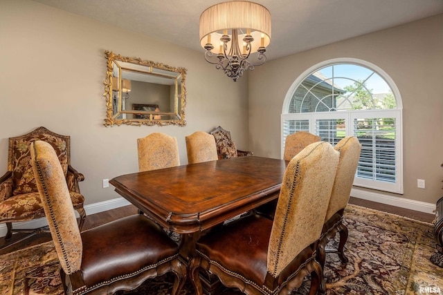 1302 Collins Ln, Marion, IL 62959 - dining room with wood finished floors, a chandelier, and baseboards