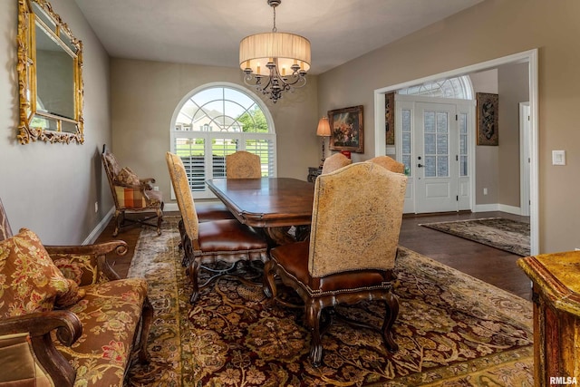 1302 Collins Ln, Marion, IL 62959 - dining space with a chandelier, wood finished floors, and baseboards