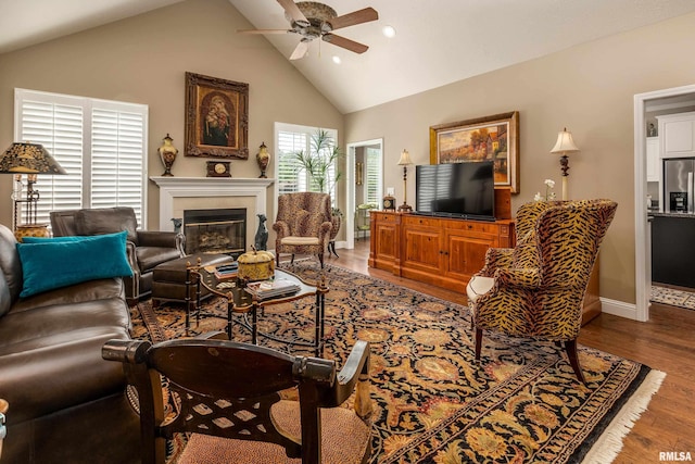 1302 Collins Ln, Marion, IL 62959 - living area featuring a ceiling fan, recessed lighting, wood finished floors, a glass covered fireplace, and high vaulted ceiling
