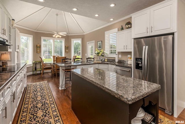 1302 Collins Ln, Marion, IL 62959 - kitchen with appliances with stainless steel finishes, a peninsula, ornamental molding, white cabinetry, and dark wood-style floors