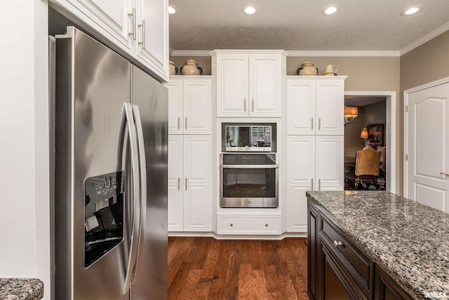 1302 Collins Ln, Marion, IL 62959 - kitchen featuring stainless steel appliances, dark stone countertops, dark wood finished floors, white cabinetry, and ornamental molding