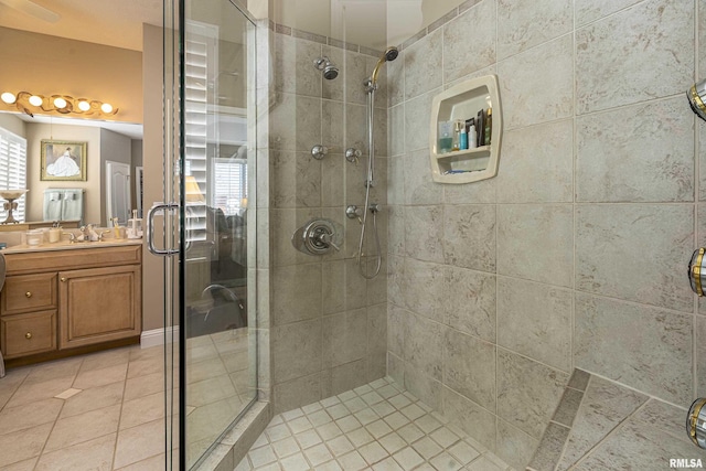 1302 Collins Ln, Marion, IL 62959 - bathroom featuring a stall shower, vanity, tile patterned floors, and plenty of natural light