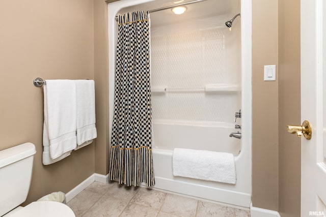 1302 Collins Ln, Marion, IL 62959 - bathroom with toilet, baseboards, and shower / tub combo