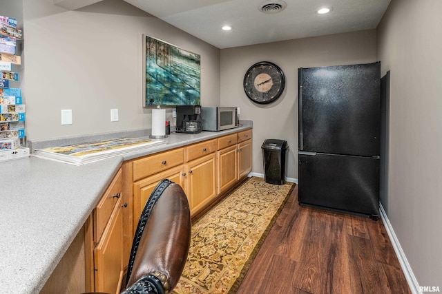 1302 Collins Ln, Marion, IL 62959 - kitchen featuring freestanding refrigerator, stainless steel microwave, dark wood-type flooring, light countertops, and recessed lighting