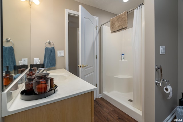 1302 Collins Ln, Marion, IL 62959 - full bath with wood finished floors, vanity, and a shower with shower curtain