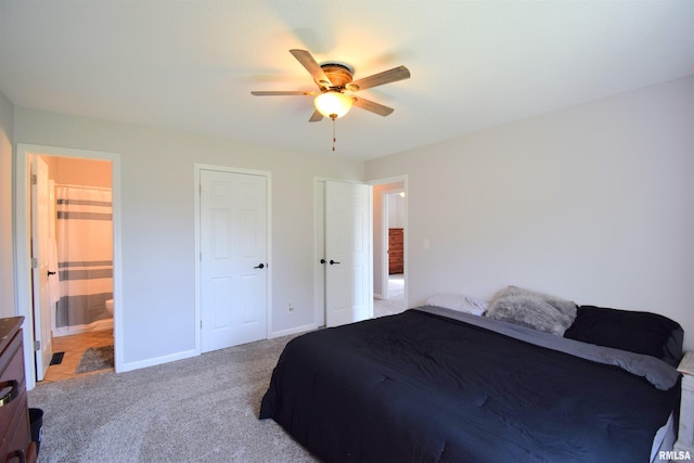 3100 Mulberry Ave, Mount Vernon, IL 62864 - bedroom featuring light colored carpet, baseboards, connected bathroom, and a ceiling fan