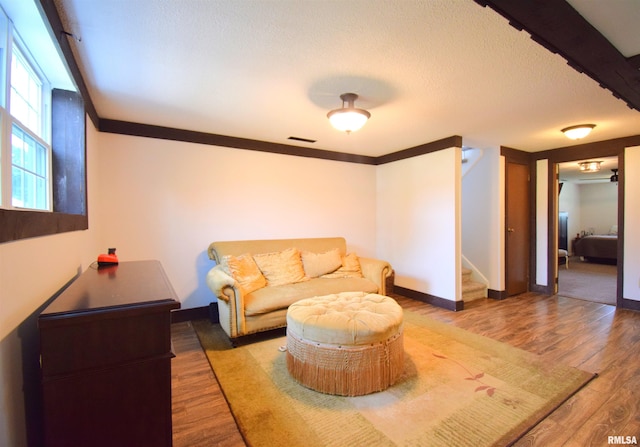 3100 Mulberry Ave, Mount Vernon, IL 62864 - living room with stairway, wood finished floors, baseboards, a textured ceiling, and ornamental molding