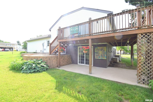3100 Mulberry Ave, Mount Vernon, IL 62864 - rear view of house featuring a lawn, a patio area, a deck, and stairs