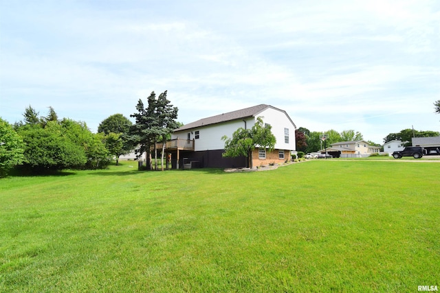3100 Mulberry Ave, Mount Vernon, IL 62864 - view of grassy yard featuring a deck and central AC