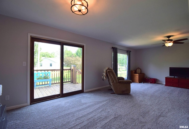 3100 Mulberry Ave, Mount Vernon, IL 62864 - living area with carpet floors, a ceiling fan, and baseboards