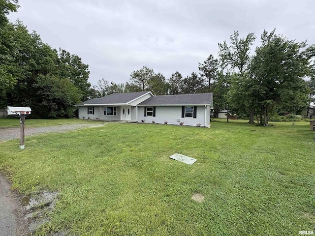 910 Fairlane Dr, Marion, IL 62959 - single story home with dirt driveway and a front lawn