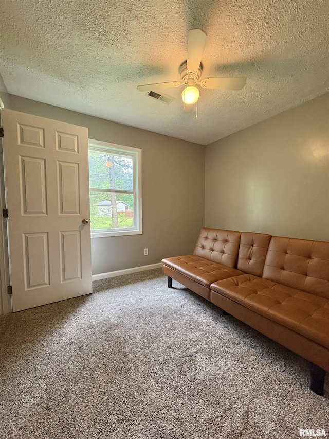 910 Fairlane Dr, Marion, IL 62959 - living area featuring carpet flooring, ceiling fan, a textured ceiling, and baseboards