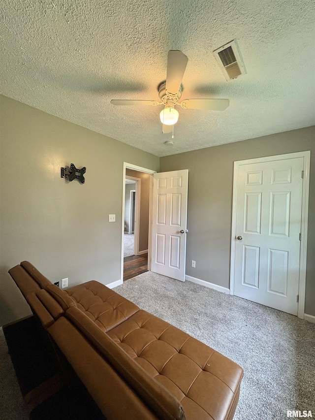 910 Fairlane Dr, Marion, IL 62959 - bedroom featuring carpet floors, baseboards, ceiling fan, and a textured ceiling