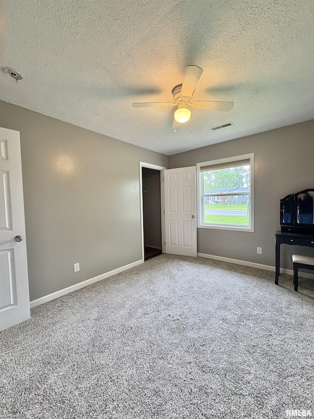 910 Fairlane Dr, Marion, IL 62959 - unfurnished living room with carpet, baseboards, a textured ceiling, and ceiling fan
