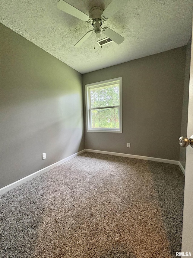 910 Fairlane Dr, Marion, IL 62959 - carpeted empty room featuring a textured ceiling, baseboards, and a ceiling fan