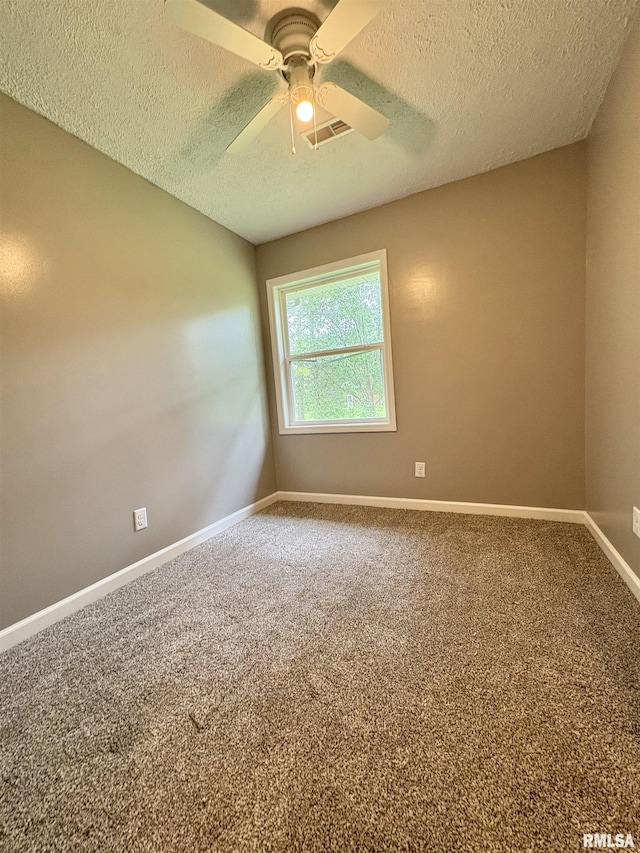 910 Fairlane Dr, Marion, IL 62959 - carpeted empty room featuring a textured ceiling, baseboards, and a ceiling fan