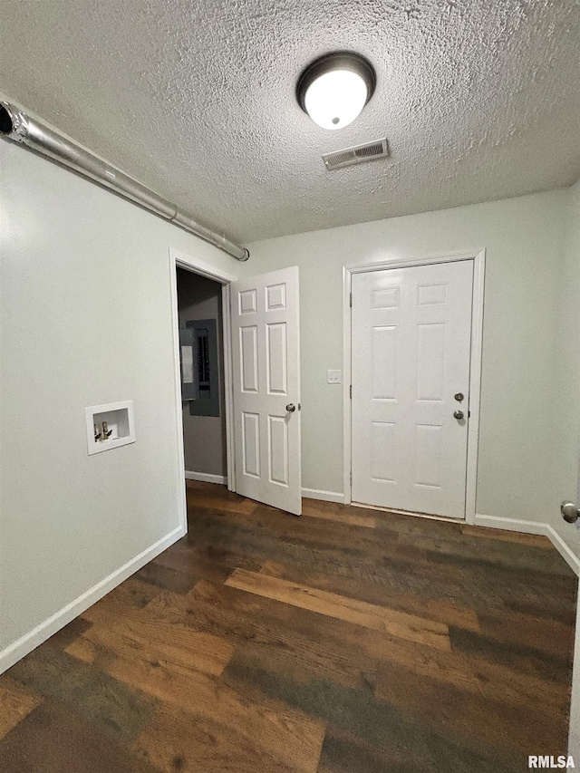910 Fairlane Dr, Marion, IL 62959 - foyer featuring a textured ceiling, wood finished floors, and baseboards