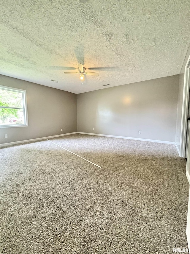 910 Fairlane Dr, Marion, IL 62959 - carpeted spare room featuring baseboards, a ceiling fan, and a textured ceiling