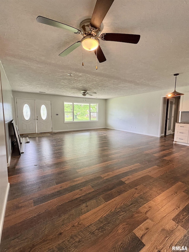 910 Fairlane Dr, Marion, IL 62959 - unfurnished living room with hardwood / wood-style floors, a textured ceiling, ceiling fan, and baseboards