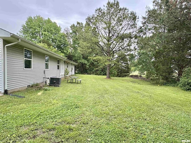 910 Fairlane Dr, Marion, IL 62959 - view of green lawn with cooling unit and view of wooded area