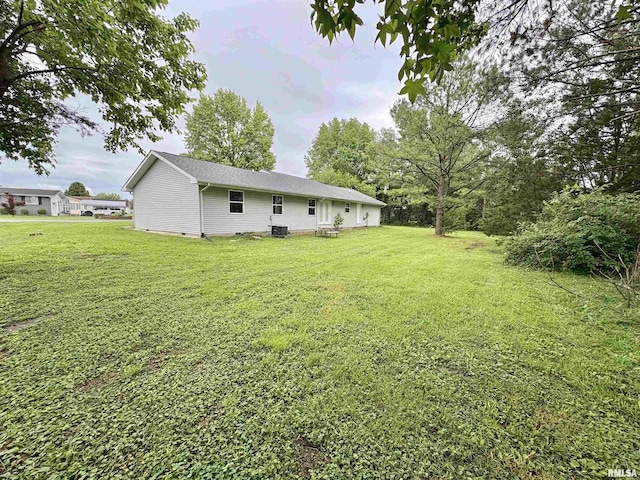 910 Fairlane Dr, Marion, IL 62959 - view of grassy yard featuring central AC