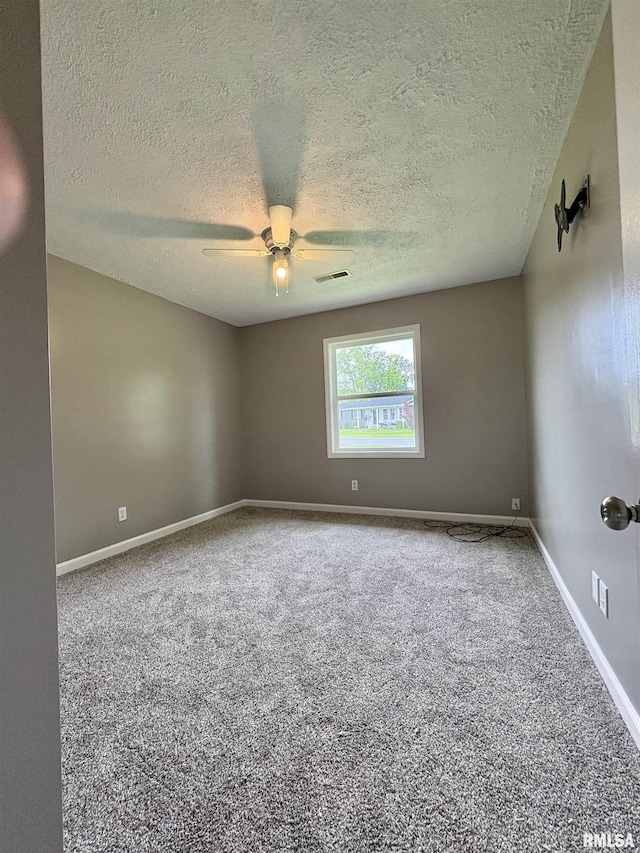 910 Fairlane Dr, Marion, IL 62959 - unfurnished room with a textured ceiling, carpet flooring, ceiling fan, and baseboards