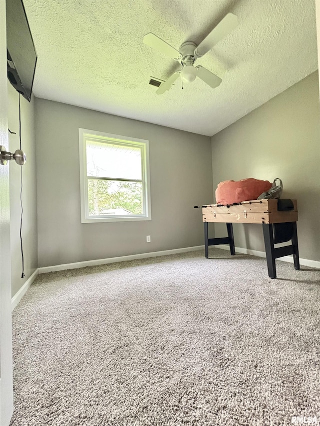 910 Fairlane Dr, Marion, IL 62959 - unfurnished bedroom featuring carpet, a textured ceiling, baseboards, and a ceiling fan
