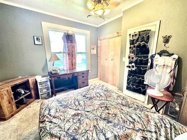 1105 N Maple St, Carterville, IL 62918 - carpeted bedroom featuring ornamental molding, a textured wall, and a chandelier