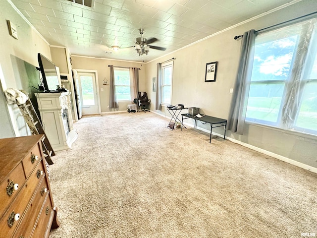 1105 N Maple St, Carterville, IL 62918 - living area featuring crown molding, light carpet, baseboards, ceiling fan, and a fireplace