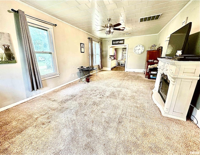 1105 N Maple St, Carterville, IL 62918 - living area with carpet floors, crown molding, a ceiling fan, and baseboards