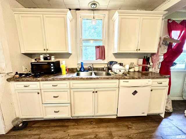 1105 N Maple St, Carterville, IL 62918 - kitchen featuring white dishwasher, a sink, black microwave, dark wood-type flooring, and dark countertops