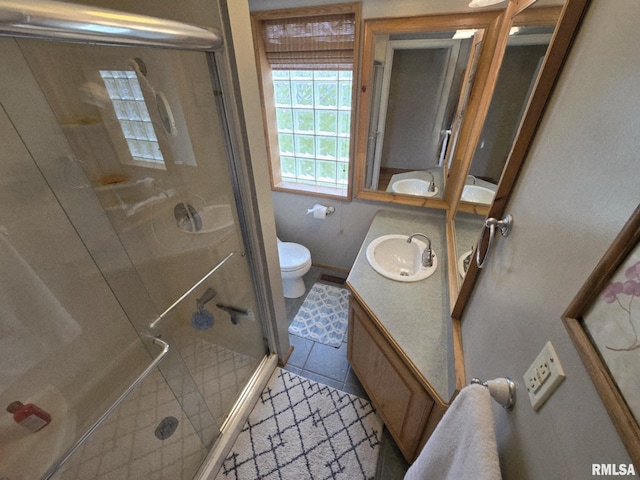 112 W Main St, Mcleansboro, IL 62859 - bathroom with vanity, a shower stall, toilet, and tile patterned flooring