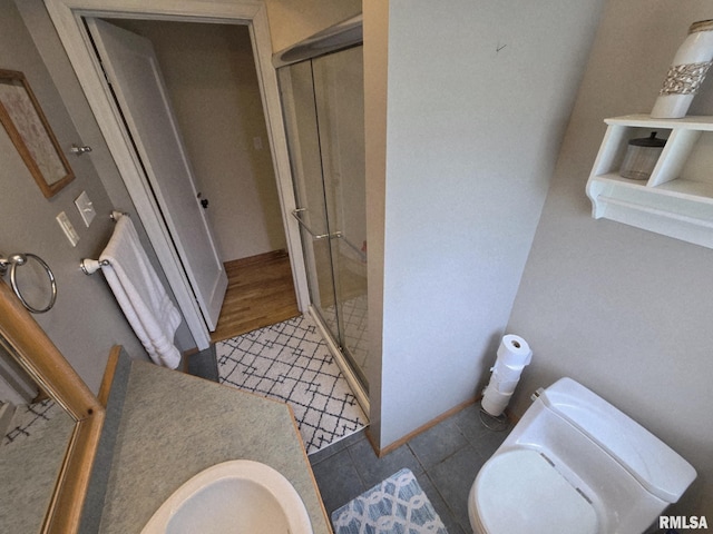 112 W Main St, Mcleansboro, IL 62859 - bathroom featuring a stall shower, toilet, tile patterned flooring, and vanity
