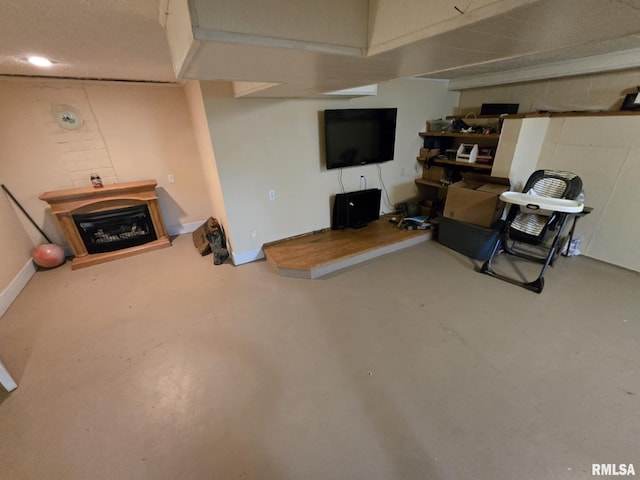 112 W Main St, Mcleansboro, IL 62859 - living room with finished concrete flooring, a fireplace, and baseboards