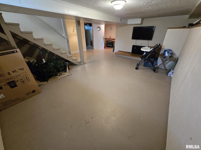 112 W Main St, Mcleansboro, IL 62859 - finished basement with a textured ceiling and stairs