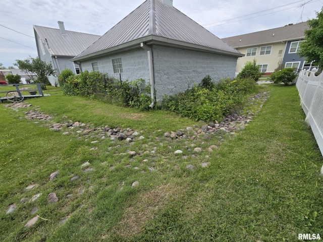 112 W Main St, Mcleansboro, IL 62859 - view of home's exterior with a chimney and metal roof