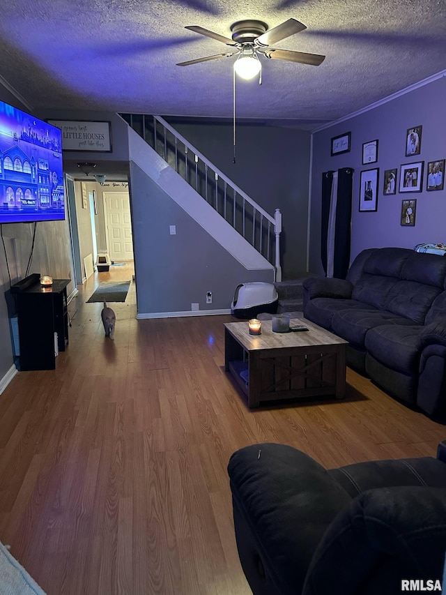 527 E Lawrence St, Benton, IL 62812 - living room with stairway, a textured ceiling, ceiling fan, and wood finished floors