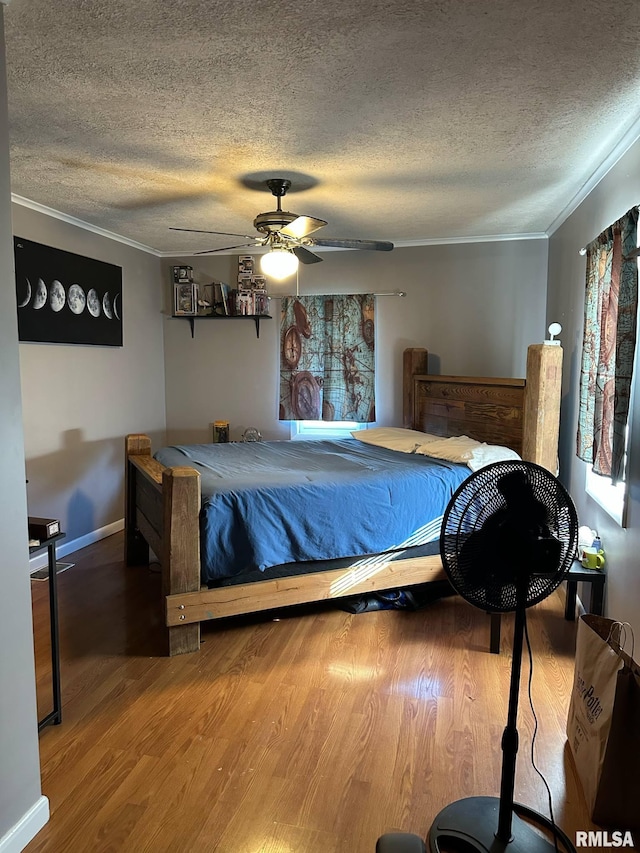 527 E Lawrence St, Benton, IL 62812 - bedroom featuring ornamental molding, a textured ceiling, wood finished floors, and ceiling fan