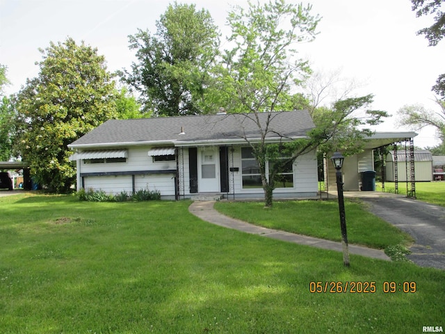 44 S Edgewood Ln, Centralia, IL 62801 - ranch-style house with asphalt driveway, a carport, and a front lawn