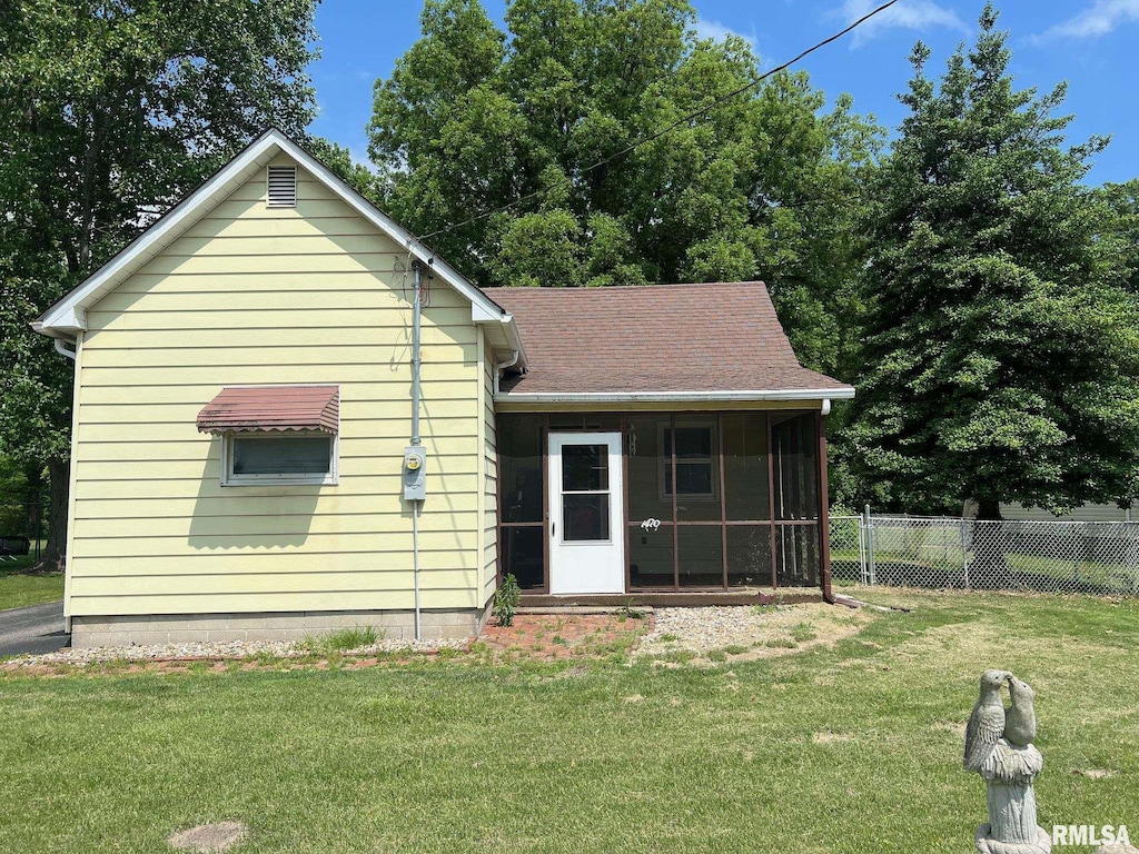 1410 N Main St, Benton, IL 62812 - back of property with a sunroom and a shingled roof