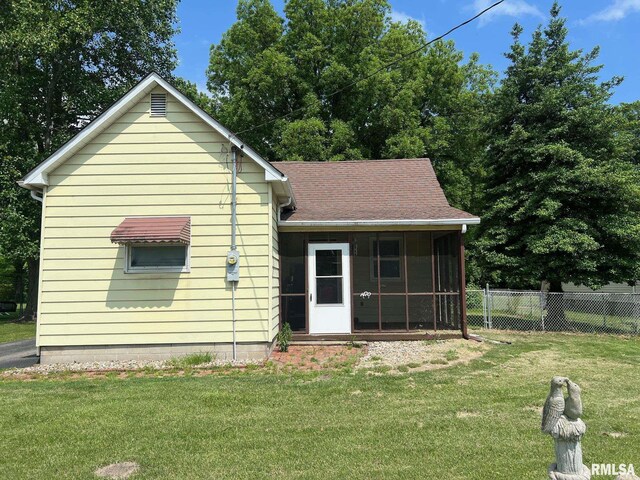 1410 N Main St, Benton, IL 62812 - back of property with a sunroom and a shingled roof