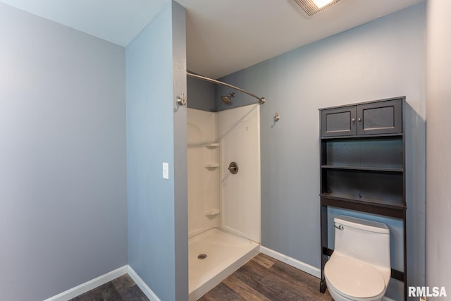 1004 Mockingbird Ln, Carterville, IL 62918 - full bath featuring wood finished floors, a shower, and toilet