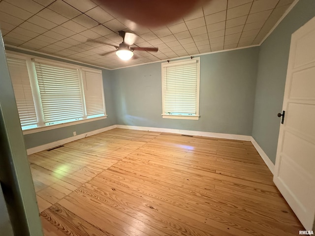 1312 W Sycamore St, Carbondale, IL 62901 - unfurnished room featuring wood-type flooring, a ceiling fan, baseboards, and crown molding