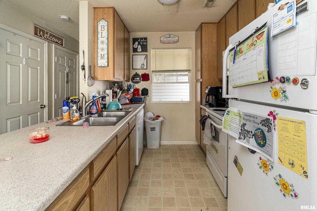 1500 Cornerstone Ct, Marion, IL 62959 - kitchen featuring white appliances, brown cabinets, a sink, and light countertops