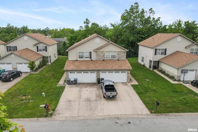 1500 Cornerstone Ct, Marion, IL 62959 - traditional-style house featuring driveway, a front lawn, stone siding, and an attached garage
